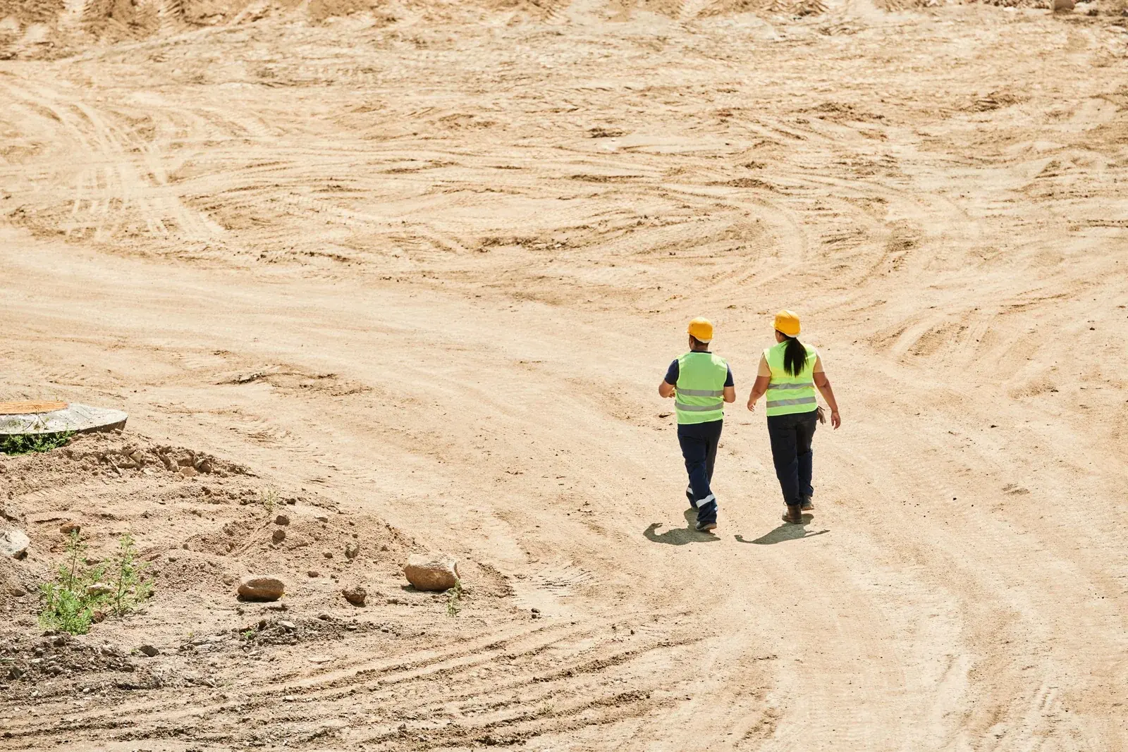 Engineers surveying a construction site from above